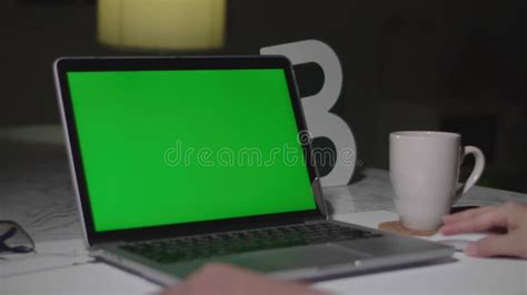 Woman Working On The Laptop Computer With Green Screen At Home Chroma