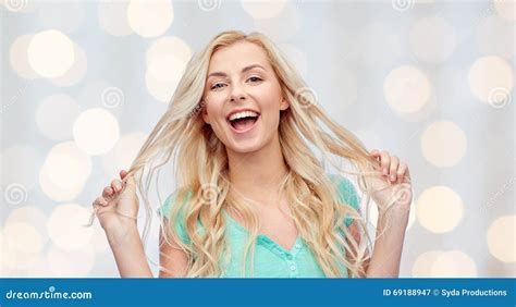 Smiling Young Woman Holding Her Strand Of Hair Stock Image Image Of