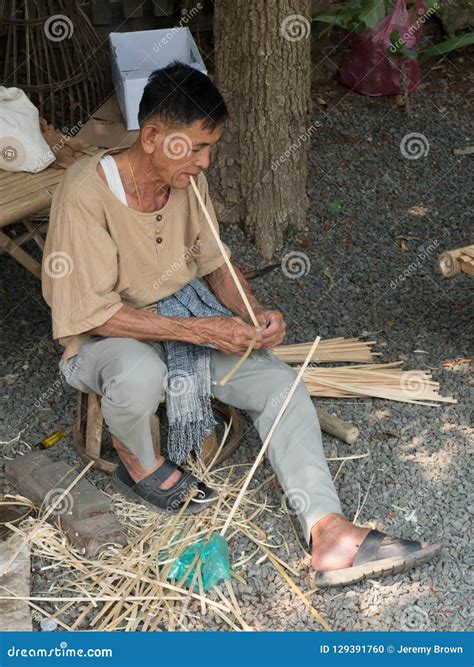 Laotian People Making Offerings To Buddhist Monks During Traditional