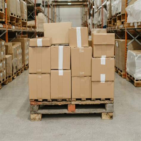 Premium Photo Workers Unloading Packaging Boxes On Pallet In