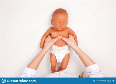 Infant First Aid Training - Doctor Showing Manual Chest Compress Stock ...