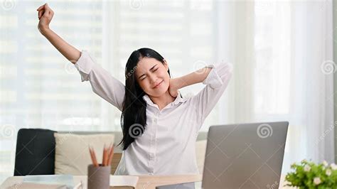 Beautiful Tired Young Asian Businesswoman Stretching Her Arms