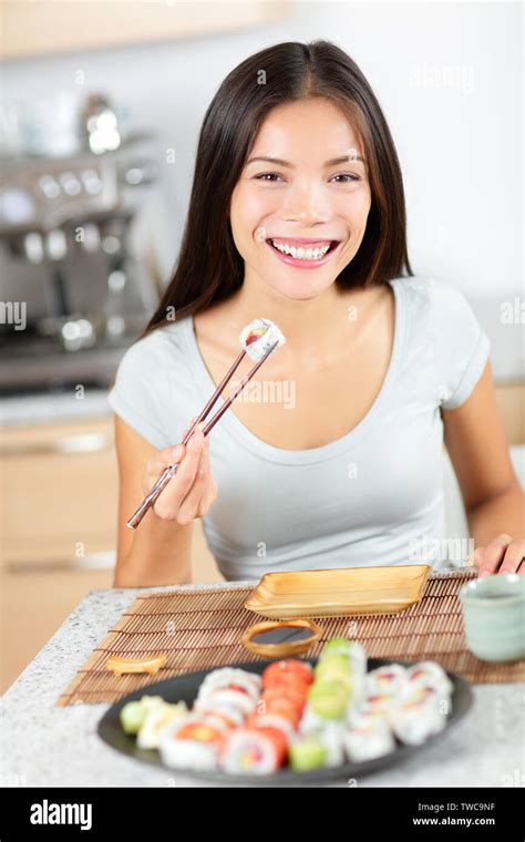 Sushi Eating Pretty Mixed Race Young Asian And Caucasian Woman