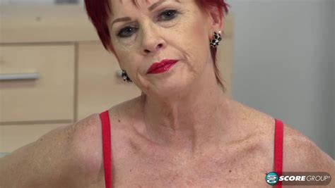 Elegant Granny Caroline Hamsel Shows Her Shaved Pussy Under The Skirt