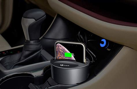 An Iphone In The Center Of A Car With A Charger On Its Side