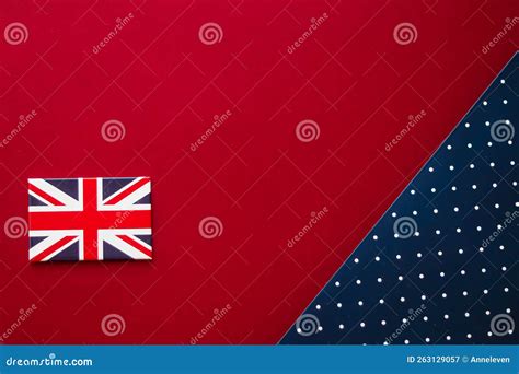 British Flag On Red And Blue Polka Dot Flatlay Background As Abstract