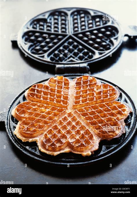 heart-shaped waffle in waffle iron Stock Photo - Alamy