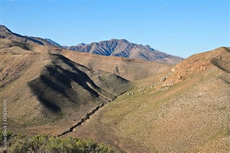 Soil erosion in a mountain valley caused by rain water. Stock Photo ...