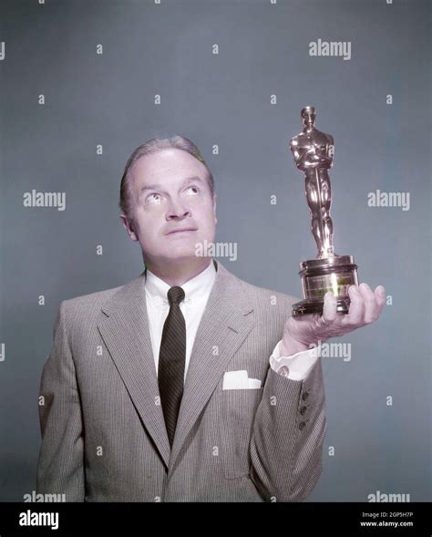 Bob Hope, who often hosted the Academy Awards presentation, holding an ...