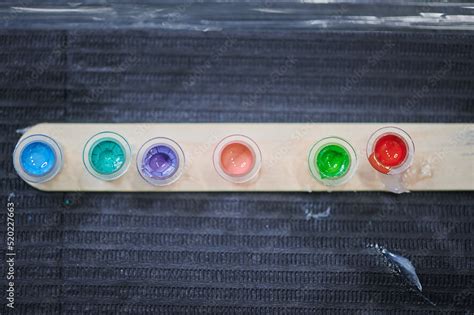 Tattoo studio scene. Color palette on the work table of a tattoo artist ...