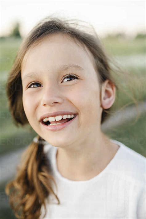 Happy Cute Girl In Field Stock Photo