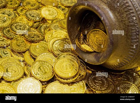 Gold coin in treasure old clay pot on a pile of gold coins Stock Photo ...