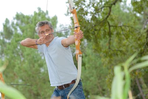 Hunting Using Bow and Arrow Stock Photo - Image of archer, bowman: 83781466