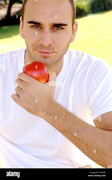 Male Short Trimmed Brunette Hair And Light Stubble Wearing A White V