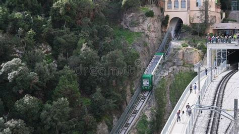 Cogwheel Train Arriving At Montserrat Monastery Passengers On The