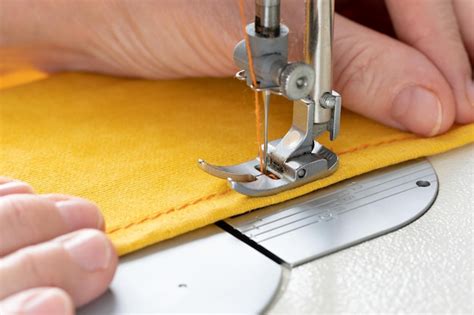 Premium Photo Hands Of Seamstress Sewing With A Professional Machine