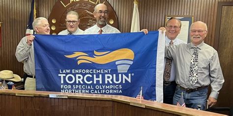 Law Enforcement Participates In Torch Run In Support Of Special