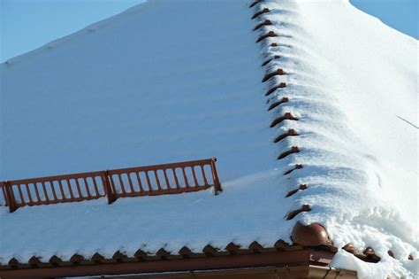 Premium Photo Snow Guard For Safety In Winter On House Roof Top Covered With Steel Shingles