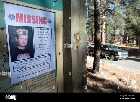 In This Nov 26 2012 File Photo A Missing Poster Of 13 Year Old Dylan Redwine Hangs On A Trail