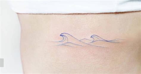 Spectrum waves tattoo located on the rib.