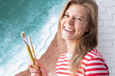 Premium Photo Talented Female Artist Standing Next To Her Painting