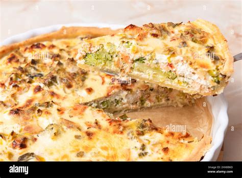 Sliced Traditional French Open Quiche Pie With Feta Cheese And Scallion