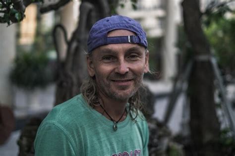 Premium Photo Portrait Of Man Wearing Cap While Standing Outdoors