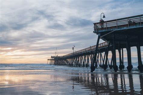 Pier that Stretches Toward the Setting Sun. an Iconic Pismo Beach Pier ...