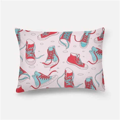 A Pillow With Sneakers On It And Ice Skates In Red Blue And White