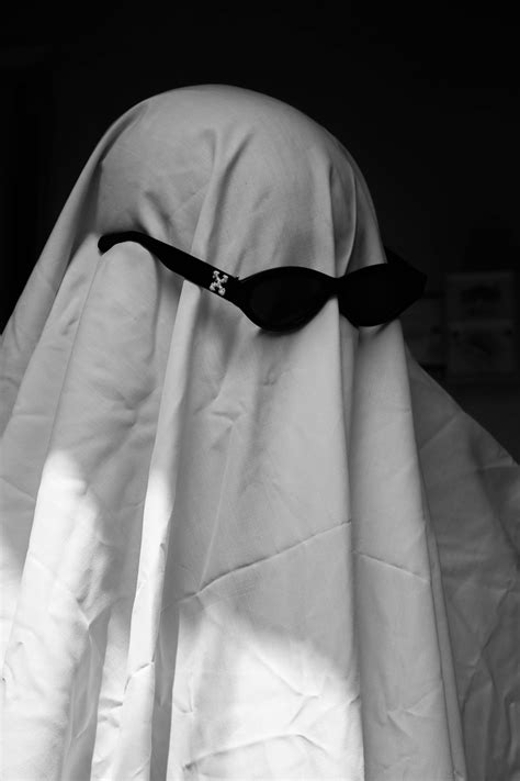 Grayscale Photo of a Person in Costume Holding a Cigarette · Free Stock