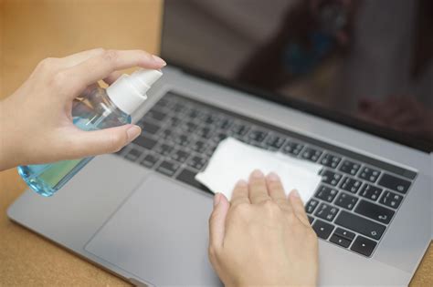 woman is cleaning laptop by alcohol spray 5127727 Stock Photo at Vecteezy