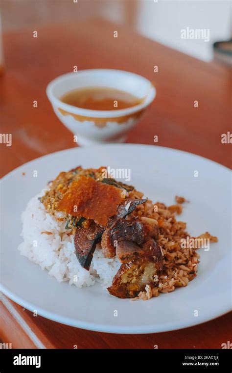 Vertical Or Portrait Shot Of A Plate Of Nasi Babi Guling Or Pork Roll