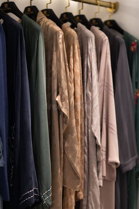 Luxury Abayas Are Hung On Black Hangers In The Store They Are Arab