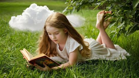 Premium Photo Girl Lying On Grass And Reading Book