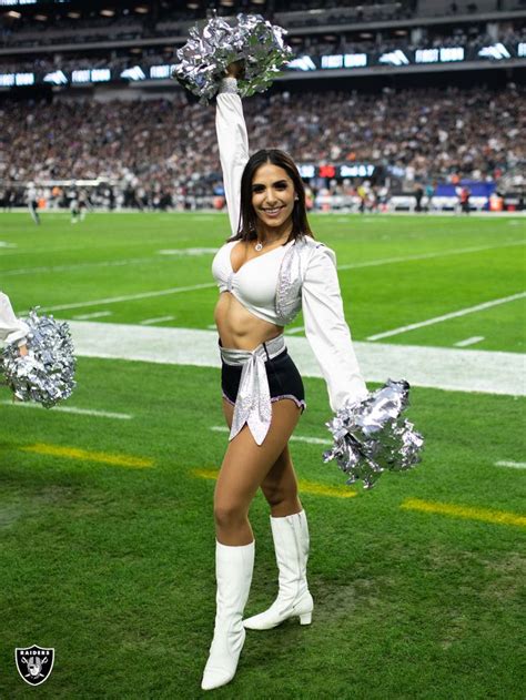 A Cheerleader Is Performing On The Field