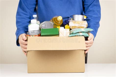 Volunteer Hands Holding Cardbox With Grocery Products Volunteer