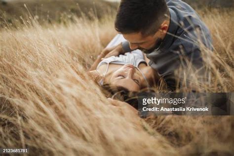 Couple Cuddling Laying Park Photos And Premium High Res Pictures Getty Images