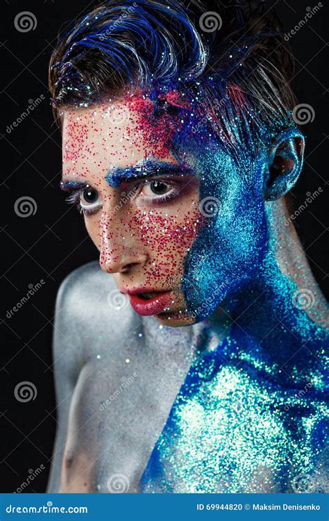 A Young Guy Androgyne Model In A White Sweater With A Rainbow Symbol