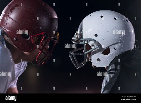 Two American Football Players Face To Face In Silhouette Shadow On