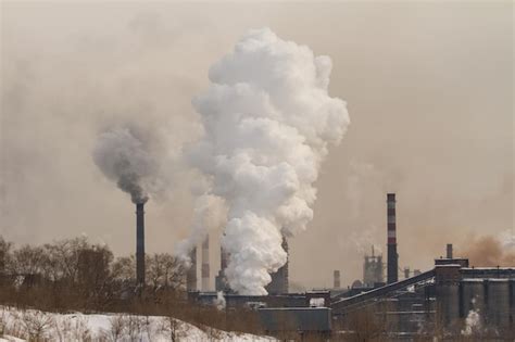 Premium Photo Smoke Emitting From Chimney Against Sky