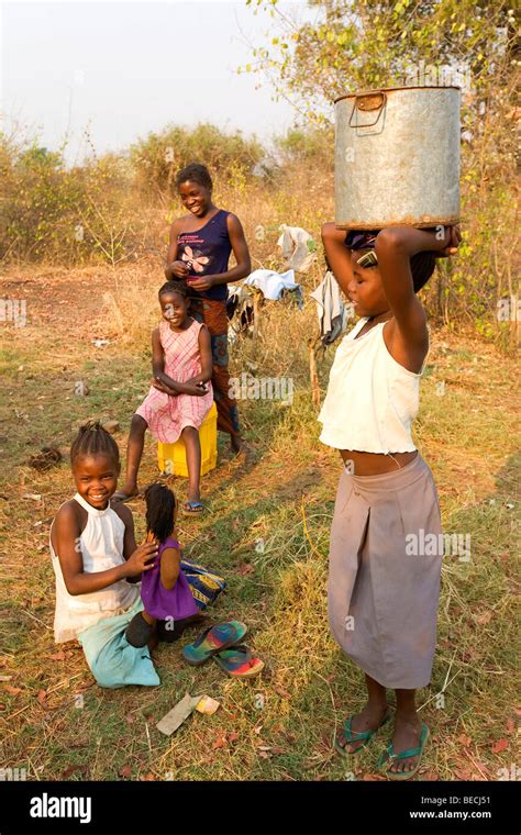 Girl Carrying A Water Jug On Her Head African Village Sambona Southern Province Republic Of