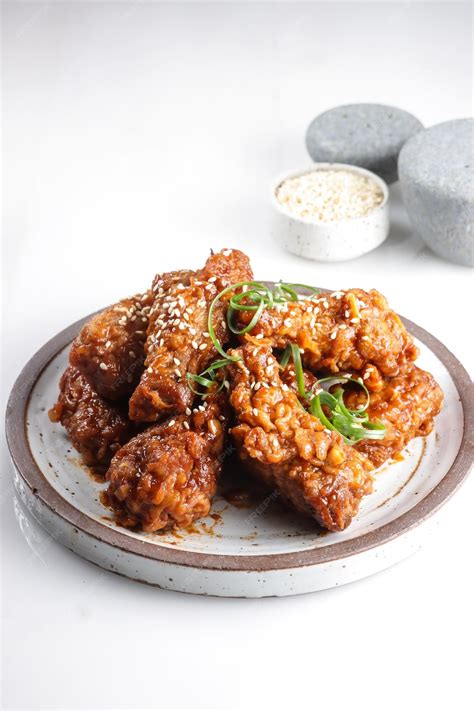 Premium Photo Korean Fried Chicken Yangnyeom Tongdak With Spicy Sauce And Sesame Seed Sayap