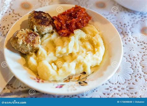 Plate With Traditional Russian Meal Of Mashed Potato Meat Cutlets