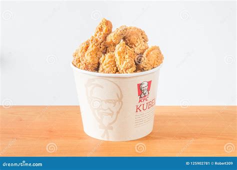 A Lots of KFC Chicken Hot Wings in Bucket of KFC Kentucky Fried Chicken ...