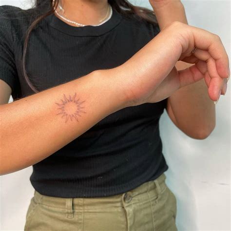 Fine Line Sun Tattoo On The Wrist