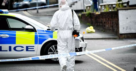 Police Cordon Off Street As Forensics Seen Carrying Out Investigation