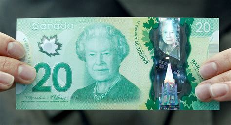 The new Canadian 20 dollar bill made of polymer is displayed at the ...