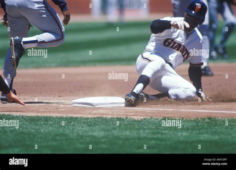 Professional Baseball Player Sliding Into Base During Game Candlestick