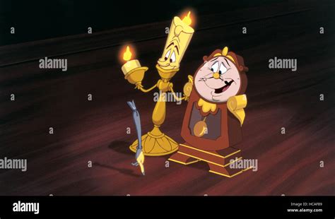 BEAUTY AND THE BEAST, l-r: Lumiere (voice: Jerry Orbach), Cogsworth ...