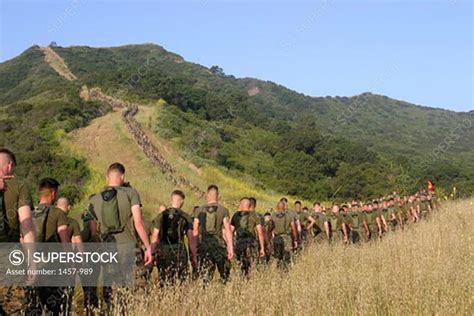 Group of Marine soldiers walking towards a memorial site, Camp Horno ...